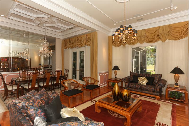 Open floor plan view from foyer of living room and dining room.