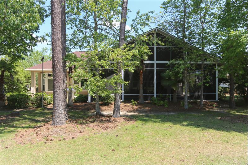 A view from the golf course of the rear of the home.