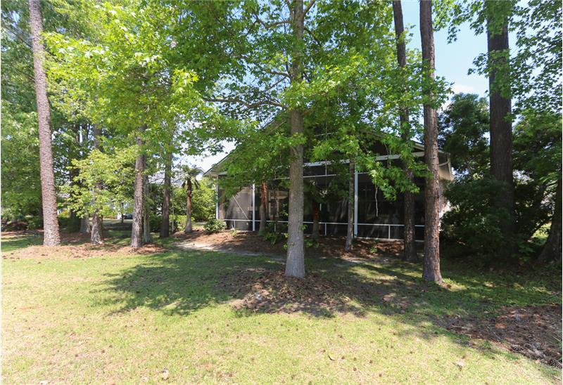 A view from the golf course of the rear of the home.