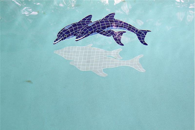 Fascinating tiled dolphin at play in the pool bottom.