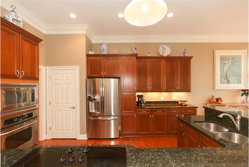 Custom shelving in the pantry next to the fridge.