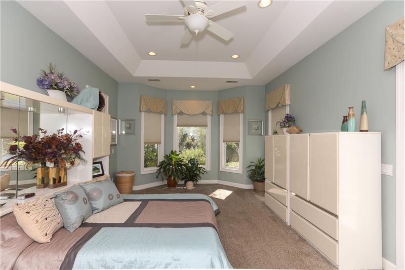 The Owner's bedroom has a bay window, door to the patio and a tray ceiling.