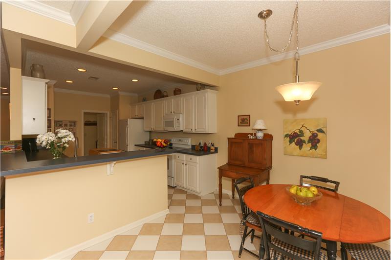 Eat-in kitchen area with bay windows
