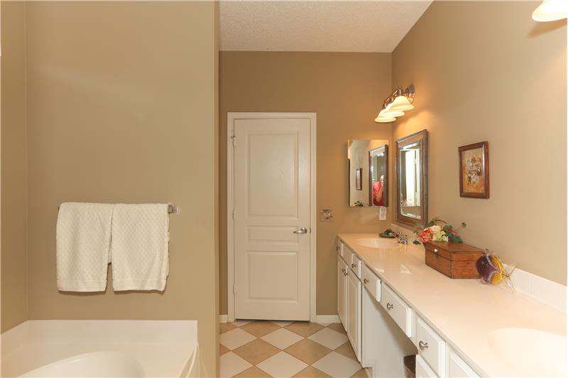 Double sinks in Owners bathroom with tiles on the diagonal
