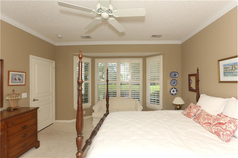 Large walk-in closet is adjacent to the dresser