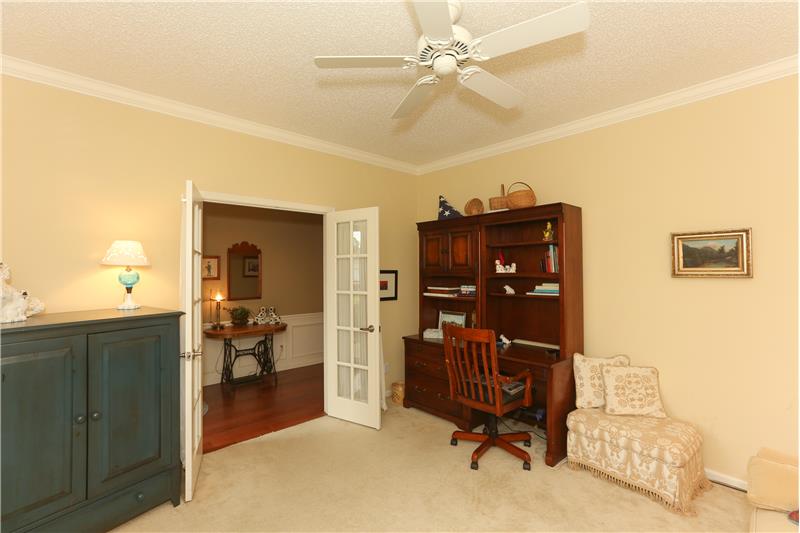 French doors give the bedroom or office/den an elegant entrance.