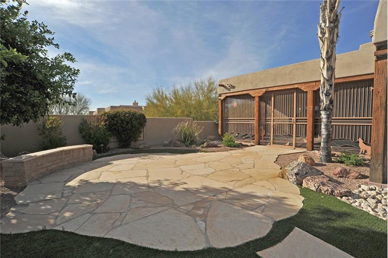 Lovely flagstone patio with seat wall