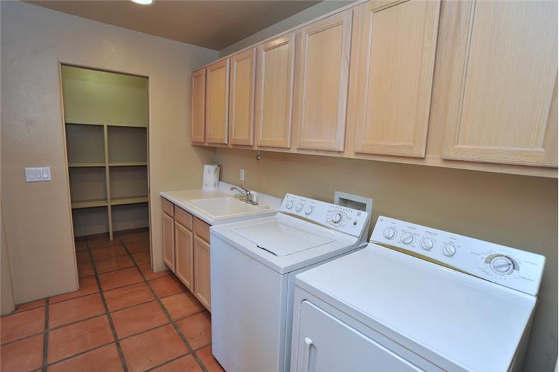 Laundry Room with cabinetry & utility sink