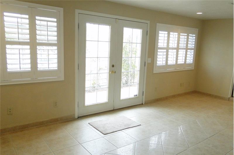 Light and bright with plantation shutters and french exterior doors in guest quarters