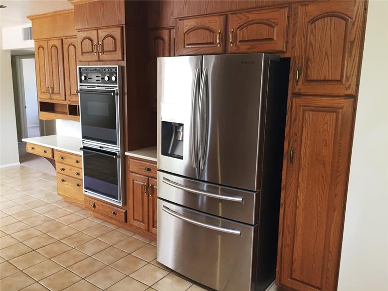 Double oven & new Samsung 4 door stainless steel refrigerator with sparkling water feature