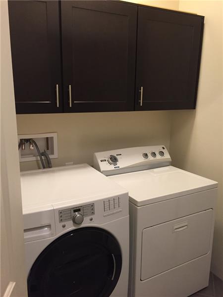 Laundry Closet with matching cabinets for storage