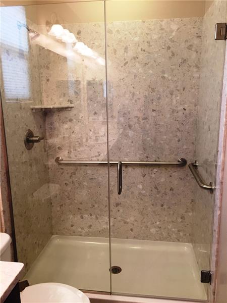 Exquisite Master Bath with upgraded frameless walk-in shower with cultured marble, safety bars & upgraded fixtures