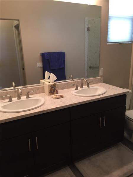 Dual vanity with upgraded plumbing & fixtures