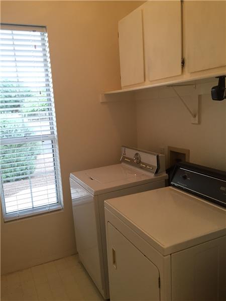Separate Laundry Room with Cabinetry