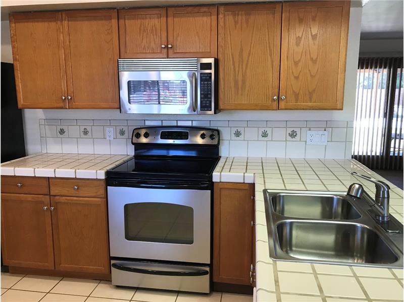 Newer Stainless Glass Cooktop Stove/Oven & Microwave