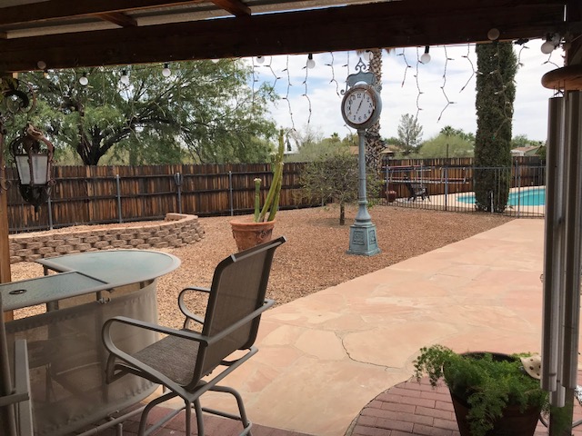 Fully landscaped with flagstone, brick, and decorative rock