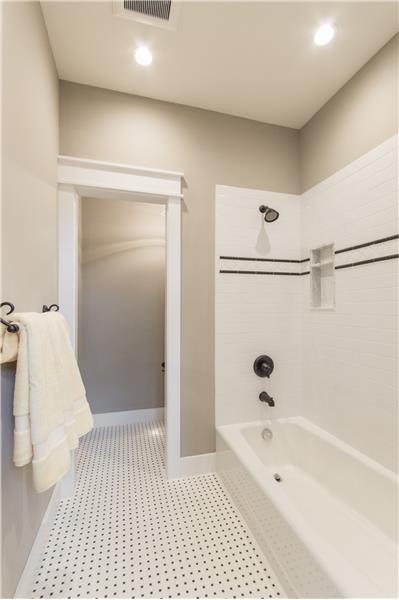 Jack and Jill tub and toilet room with 2 niches