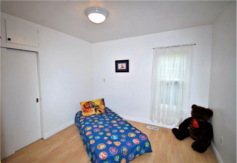 The first bedroom on your right has a large closet with built-in cabinets above it.