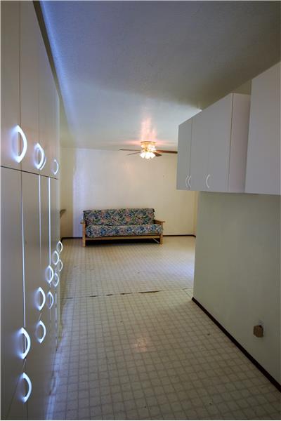 The hallway to the family room is lined in cabinets.  Great place for storing backpacks, shoes and purses!