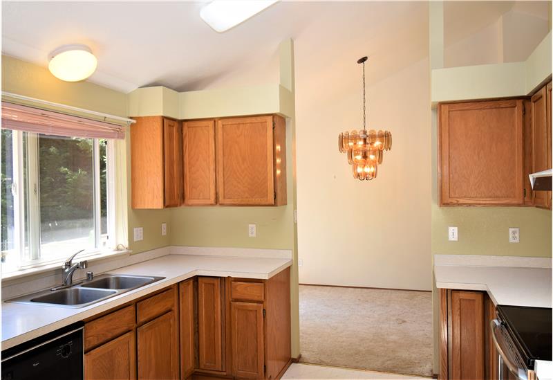 Directly behind the kitchen is the dining room.