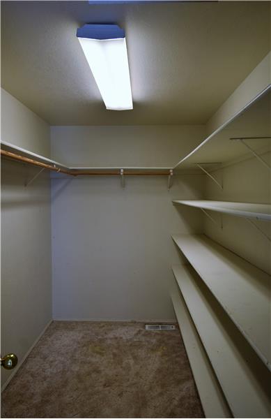 I love all the shelving in this closet!  Lots of room for all your clothes!