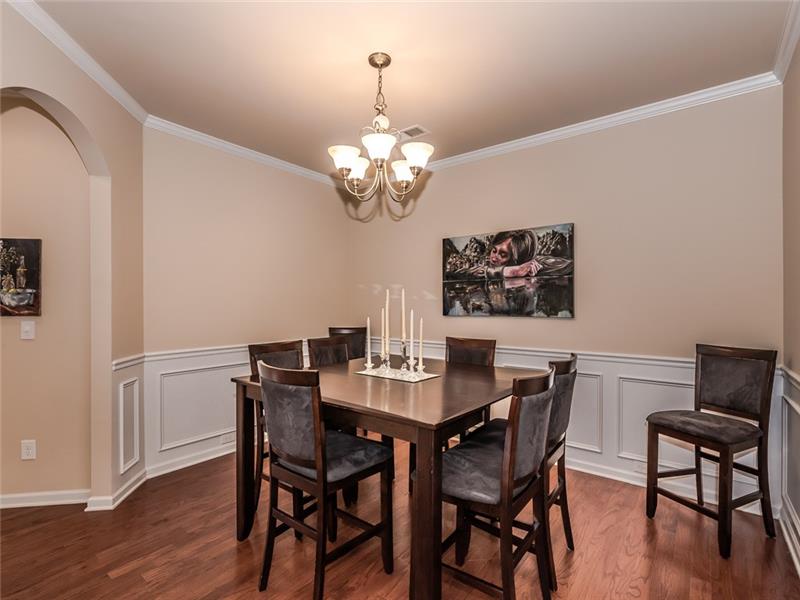 11312 Ardrey Crest Drive: Stylish formal dining room with mill work, hardwood floors.