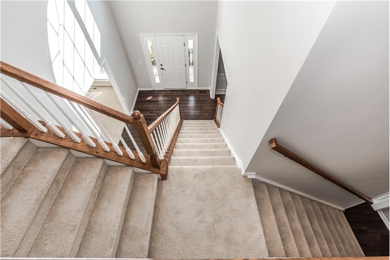 Split staircase provides the convenience of a front and back staircase.