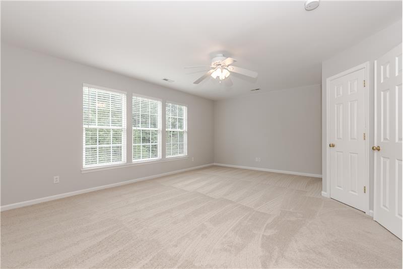 Large bonus/rec room with plenty of space for large screen TV + a closet.