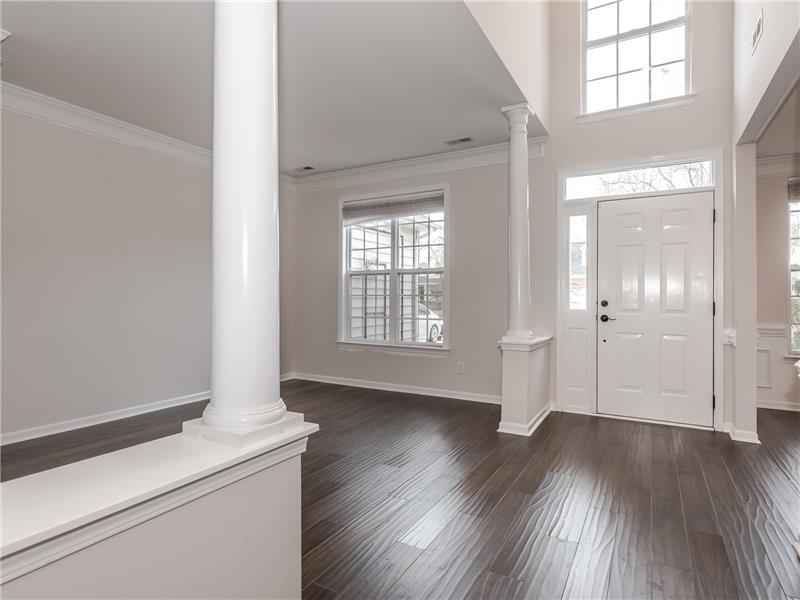 2-story foyer with new hardwood floors flanked by formal living and dining rooms.