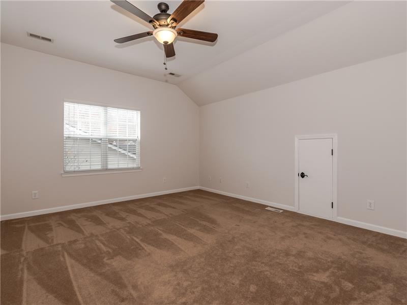 One of three additional bedrooms on second floor, all with ceiling fans/lights and wall-to-wall carpet.