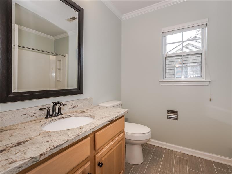 Shared bathroom on second floor of home.