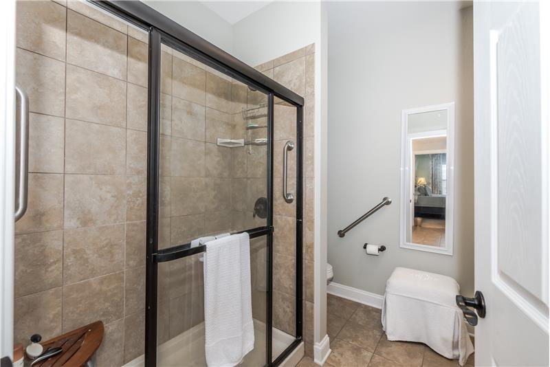 Large, step-in, tiled shower and private WC + walk-in closet.