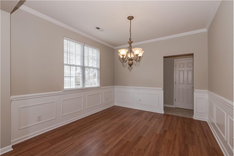 Nice mill work includes chair rail, shadow boxes, and crown molding