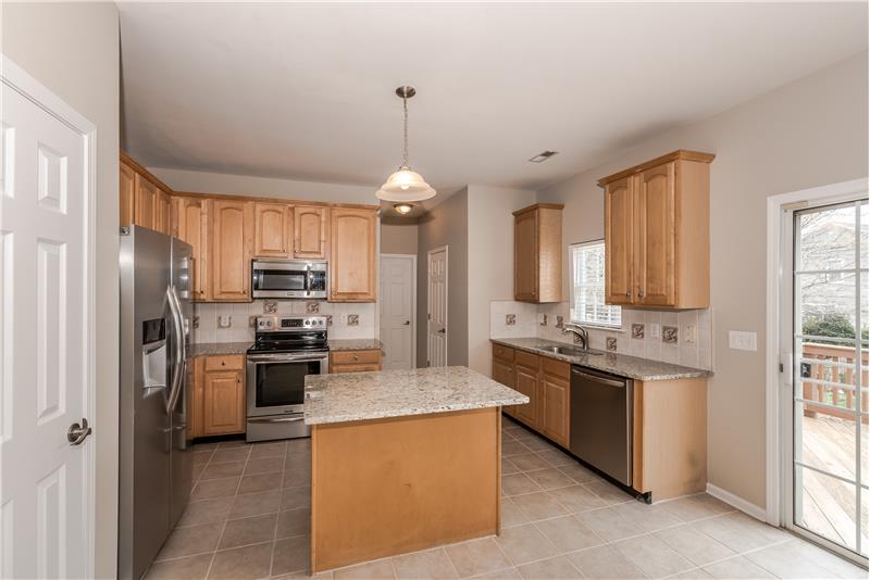 Kitchen features island with seating, new granite counters throughout