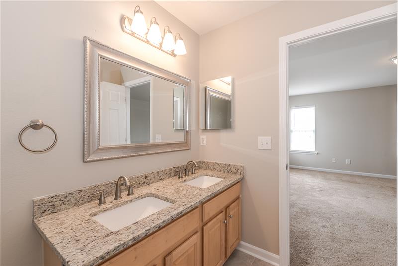 Master bathroom has new granite counters, new fixtures, new mirror, new tile floors, fresh paint