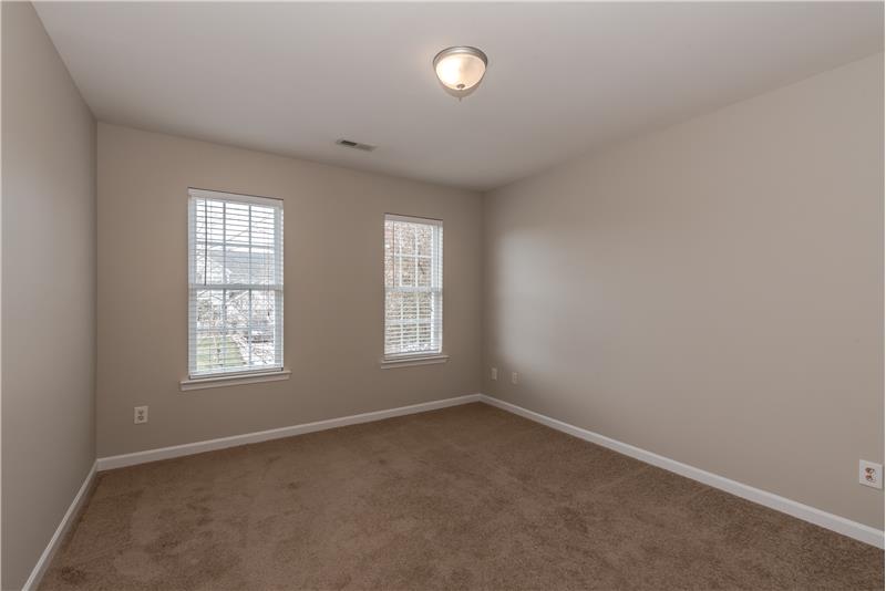 One of two additional bedrooms on second floor, also with fresh paint, new light fixture
