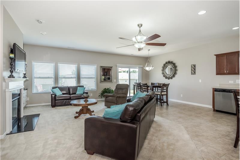 Large great room with open sight lines to dining area and kitchen