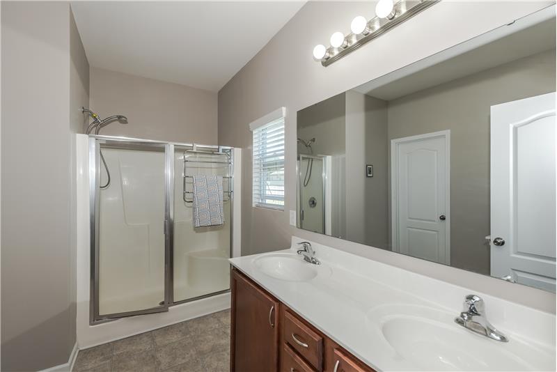 En-suite master bathroom with double-sink vanity