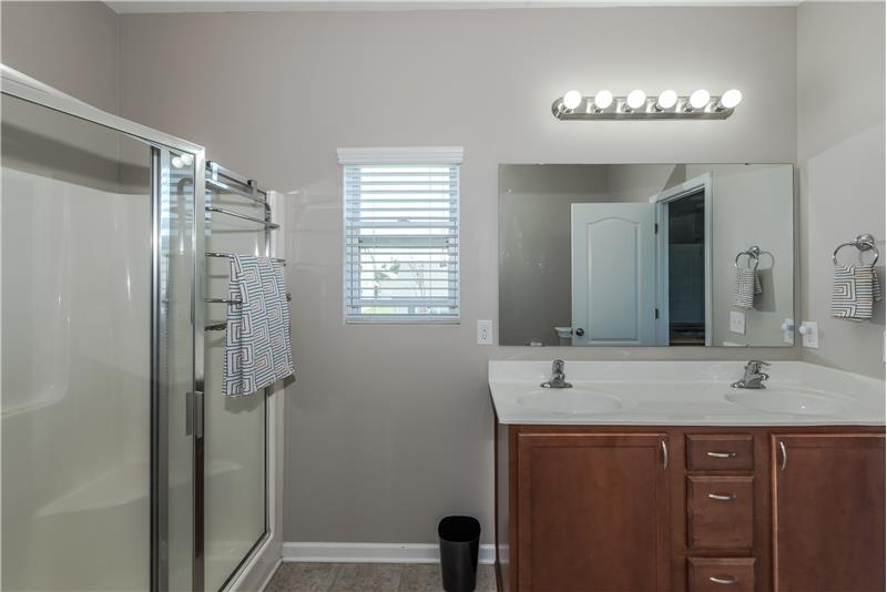 Over-sized, step-in shower and large walk-in closet in the master suite's bathroom