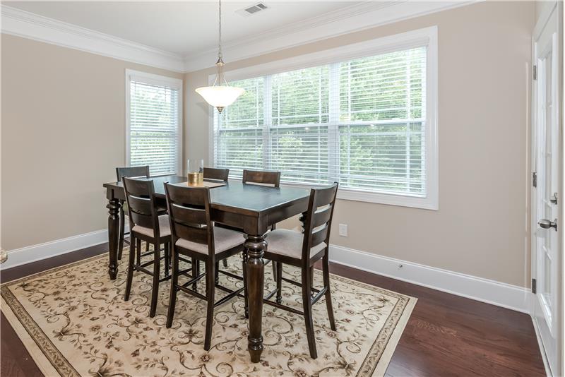 So much more than an ordinary breakfast nook.. sunny, gorgeous hardwood floors. Perfect for casual entertaining and daily dining