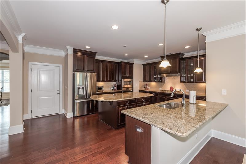 What cook wouldn't love this kitchen with granite counters, stainless steel appliances, beautiful cabinets?