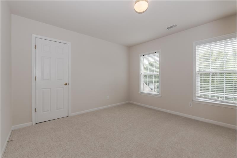 One of three additional bedrooms on second floor, all with new carpet and fresh paint