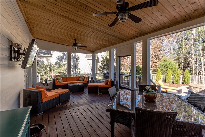 Custom screened porch with trex flooring and cedar ceiling.