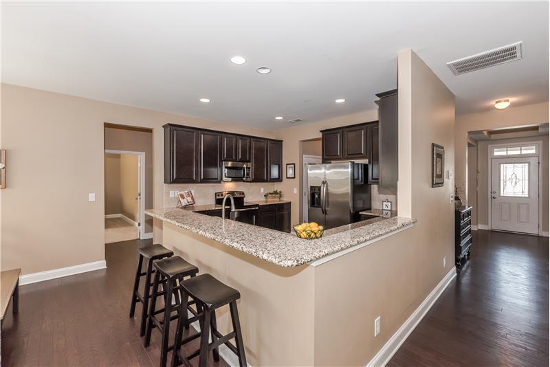Large kitchen with open sight lines to the family room. Breakfast bar with seating.