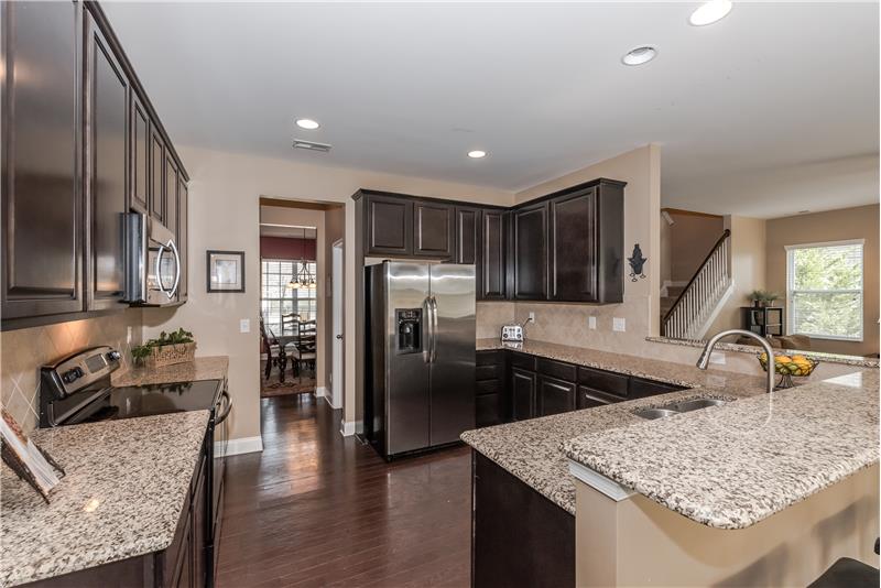 Breakfast bar, granite counters galore, lots of cabinet storage, stainless steel appliances.