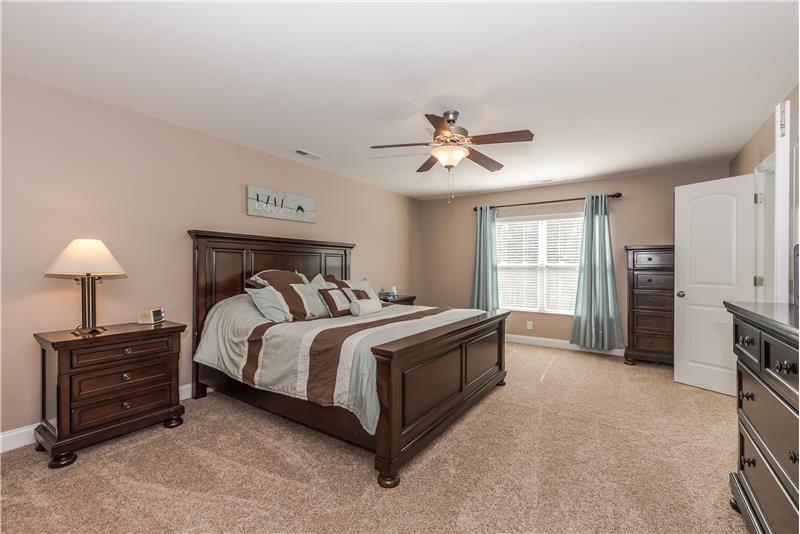 Serene and spacious master suite with room for king-size bed,larger dressers, sitting area.