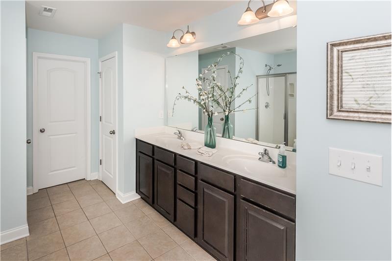 Master bath also features Additional features tile floors, linen closet.