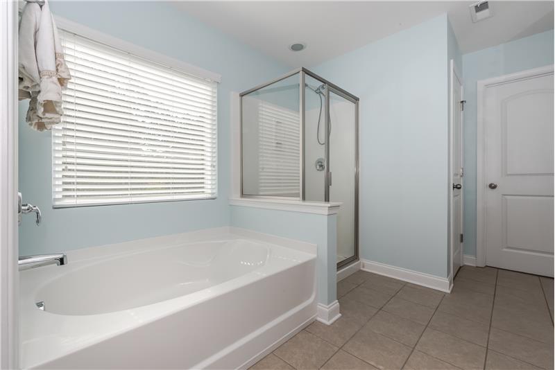 Large window over tub provides excellent natural light.