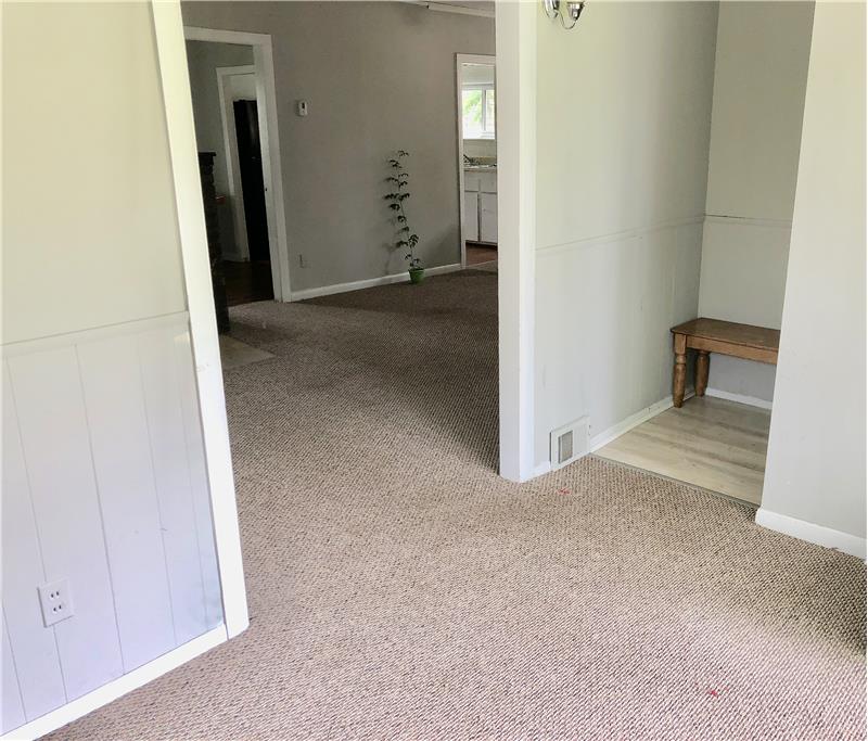 View into living room from enclosed porch area