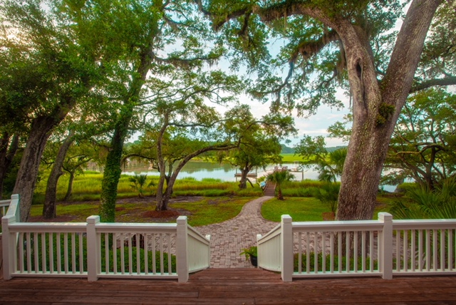 Patio and walkway to private dock in back yard.